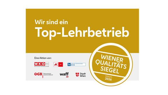Auszeichnung mit der Aufschrift "Wir sind ein Top-Lehrbetrieb, Wiener Qualitätssigel, gültig bis 2026"